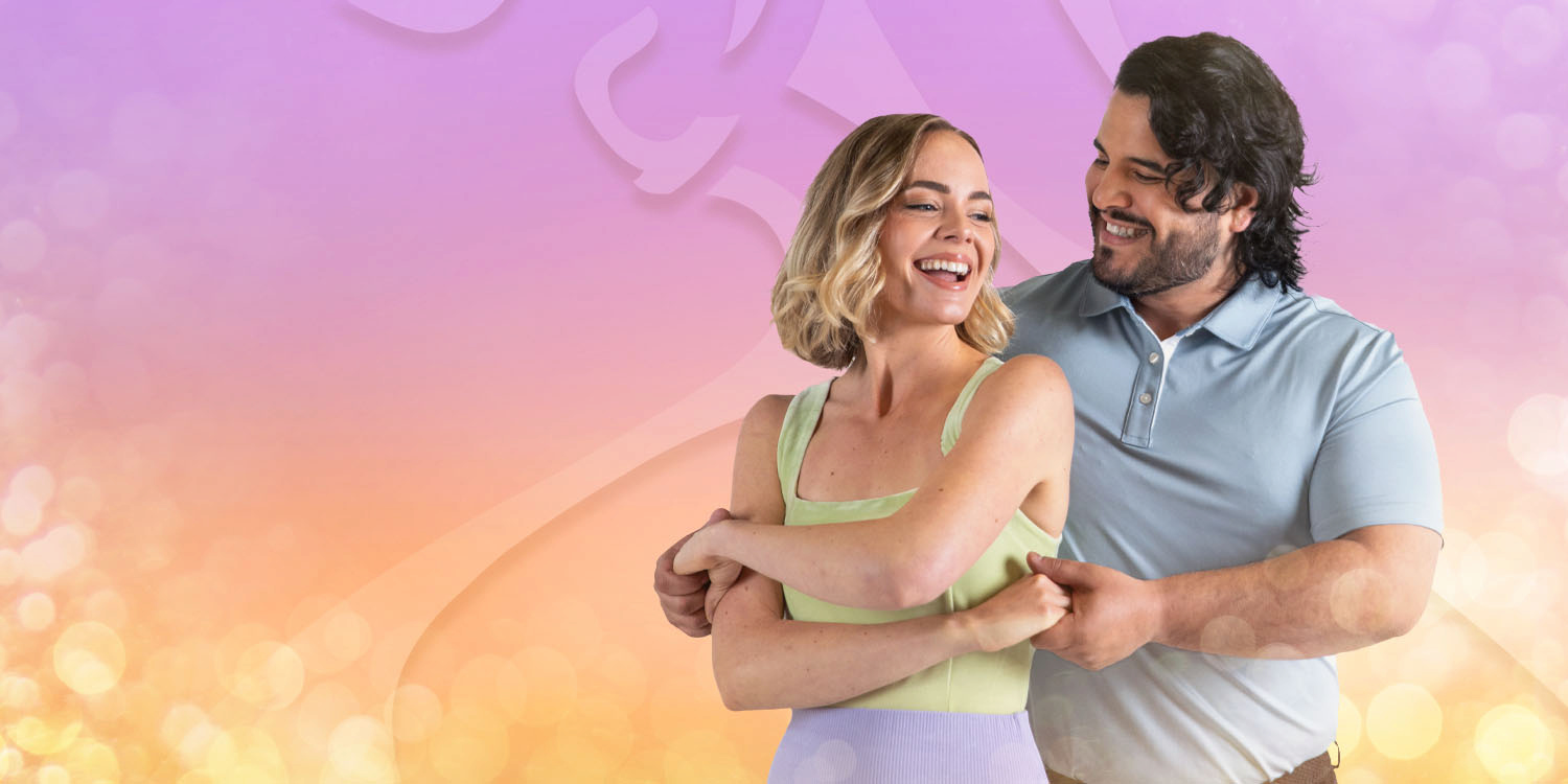 Young couple dancing in the heat of Summer